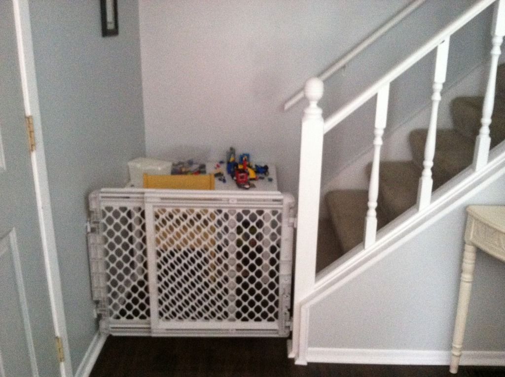 baby gate at the bottom of stairs