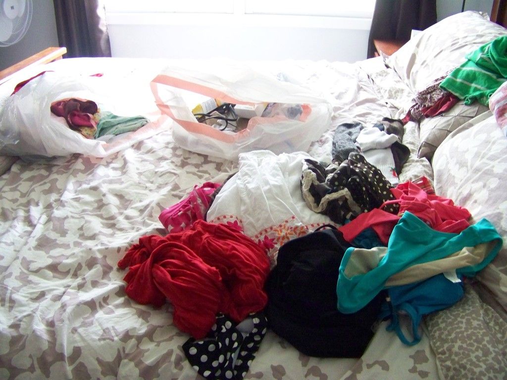 organizing clothes on my bed