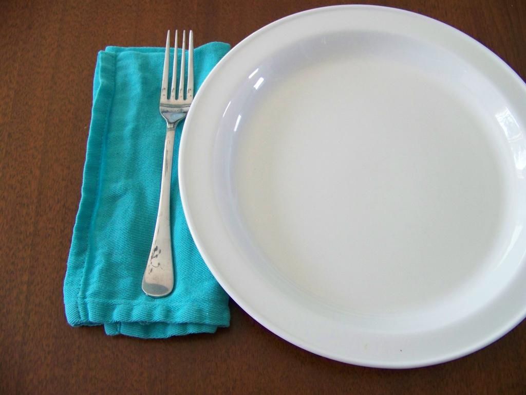 cloth napkins next to a plate