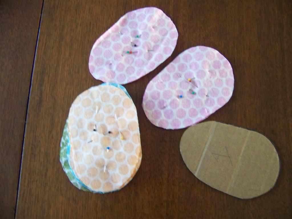 the fabric cut out in the egg shape and pinned together