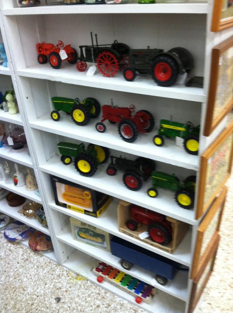 toy tractors on a shelf