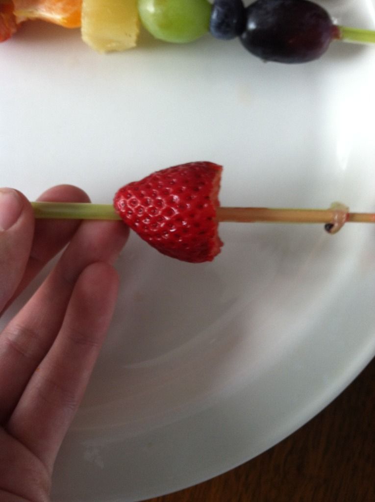 strawberry and other fruit on straws